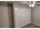 Bedroom showcasing a standard closet, perfect for storage at 702 S Grand Hwy, Clermont, FL 34711
