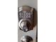 Close-up of a Schlage digital keypad lock on a door at 702 S Grand Hwy, Clermont, FL 34711