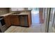 Updated kitchen features stainless steel appliances and a view of the adjacent living area at 702 S Grand Hwy, Clermont, FL 34711
