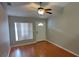 Inviting living room with a ceiling fan, natural light, and a front door at 702 S Grand Hwy, Clermont, FL 34711