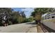 Scenic street view showcasing a home's proximity to nature and mature trees at 702 S Grand Hwy, Clermont, FL 34711
