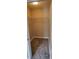 Spacious walk-in closet provides ample storage with shelving and carpeting at 702 S Grand Hwy, Clermont, FL 34711