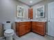 Bathroom boasts double sink vanity and modern lighting at 102 Cedar Way, Yalaha, FL 34797