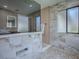 Marble tile in bathroom with a rain showerhead at 102 Cedar Way, Yalaha, FL 34797