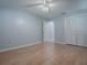 Bedroom with wood floors, ceiling fan, and closet at 102 Cedar Way, Yalaha, FL 34797