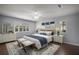 Inviting bedroom with a ceiling fan and shuttered windows at 102 Cedar Way, Yalaha, FL 34797