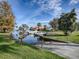 Community boat ramp with boats docked, perfect for waterfront living and boating enthusiasts at 102 Cedar Way, Yalaha, FL 34797