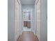 Hallway view through doorway to the vanity with cabinets at 102 Cedar Way, Yalaha, FL 34797