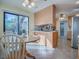Open kitchen area featuring a breakfast nook and bright natural light at 102 Cedar Way, Yalaha, FL 34797