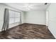 Spacious bedroom with natural light and laminate floors at 11584 Se 175Th St, Summerfield, FL 34491