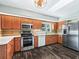 Updated kitchen with stainless appliances, wood cabinets and granite countertops at 11584 Se 175Th St, Summerfield, FL 34491