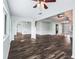 The living room offers an open floor plan, ceiling fans and laminate floor at 11584 Se 175Th St, Summerfield, FL 34491