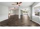 Bright living room features hardwood floors and ceiling fans at 11584 Se 175Th St, Summerfield, FL 34491
