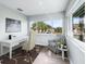 Bright office boasts large windows with palm tree view at 11584 Se 175Th St, Summerfield, FL 34491