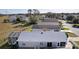 Aerial view of the property featuring a screened in patio and backyard, showing neighborhood at 1639 Campos Dr, The Villages, FL 32162