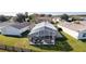 Aerial view of the screened patio highlighting outdoor dining and relaxing in your hot tub at 1639 Campos Dr, The Villages, FL 32162