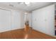 Spacious bedroom with a large closet and wood floors, offering ample storage and a clean, modern aesthetic at 1639 Campos Dr, The Villages, FL 32162