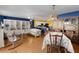 Dining room with blue walls, wood floors and wooden table at 1639 Campos Dr, The Villages, FL 32162