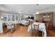 Open concept living and dining room area features hardwood floors and ample natural light at 1639 Campos Dr, The Villages, FL 32162