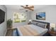 Comfortable bedroom with a large window, neutral walls, and modern decor, offering a tranquil retreat at 1897 Caryle Ln, The Villages, FL 32162