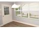 Bright dining area has laminate floors, door to the outside, and windows for plenty of light at 1897 Caryle Ln, The Villages, FL 32162