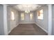 Bright dining room with modern flooring, light-colored walls, and decorative columns, perfect for Gathering meals at 1897 Caryle Ln, The Villages, FL 32162