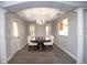 Cozy dining room featuring stylish chairs, dark wood table, and modern flooring, perfect for hosting gatherings at 1897 Caryle Ln, The Villages, FL 32162