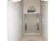 Front entry with neutral colored door and sidelights at 1897 Caryle Ln, The Villages, FL 32162