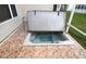 A close up of the hot tub in the sunroom with an open cover at 1897 Caryle Ln, The Villages, FL 32162
