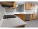 Bright kitchen featuring quartz countertops, stainless steel appliances, and a view to the dining room at 1897 Caryle Ln, The Villages, FL 32162