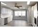 Bright kitchen and dining area with wood look floors and stainless steel appliances at 1897 Caryle Ln, The Villages, FL 32162