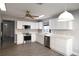 Bright kitchen with updated appliances, ample counter space and wood look floors at 1897 Caryle Ln, The Villages, FL 32162