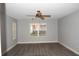 Inviting living room featuring a ceiling fan, ample lighting, and neutral walls, providing a comfortable living space at 1897 Caryle Ln, The Villages, FL 32162