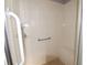 Walk in shower with grab bar and seat at 1897 Caryle Ln, The Villages, FL 32162