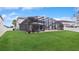 Large backyard with pool and covered patio at 2197 Pearl Cider St, Orlando, FL 32824