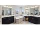 Double vanity bathroom with soaking tub and walk-in shower at 2197 Pearl Cider St, Orlando, FL 32824