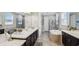 Luxurious bathroom with double vanity, soaking tub, and walk-in shower at 2197 Pearl Cider St, Orlando, FL 32824