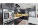 Modern kitchen featuring stainless steel appliances and ample counter space at 2197 Pearl Cider St, Orlando, FL 32824