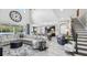 Open concept living room with a large sectional sofa at 2197 Pearl Cider St, Orlando, FL 32824