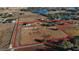 Expansive aerial view of the property, showcasing the home and outlining the large acreage with surrounding lush greenery at 2437 Bay Lake Loop, Groveland, FL 34736