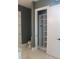 A view from the bathroom featuring a white marble floor and an alcove closet for storage at 2437 Bay Lake Loop, Groveland, FL 34736