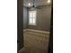 Neutral bedroom with a ceiling fan and a window with white shutters at 2437 Bay Lake Loop, Groveland, FL 34736