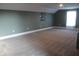 Spacious carpeted bonus room offering versatile living space and natural light from a bright window at 2437 Bay Lake Loop, Groveland, FL 34736