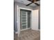 Bedroom closet with shelving, open doors, and a ceiling fan at 2437 Bay Lake Loop, Groveland, FL 34736