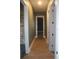 Hallway with wood-look flooring at 2437 Bay Lake Loop, Groveland, FL 34736