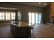 Kitchen island with a black faucet overlooks the living room fireplace and outside patio at 2437 Bay Lake Loop, Groveland, FL 34736