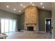 Warm living area featuring a brick fireplace, recessed lighting, and sliding glass doors to the backyard at 2437 Bay Lake Loop, Groveland, FL 34736