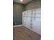 Office with built-in shelving and cabinets and wood flooring at 2437 Bay Lake Loop, Groveland, FL 34736
