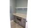 Well-organized pantry with granite countertop, built-in microwave, and custom cabinetry at 2437 Bay Lake Loop, Groveland, FL 34736