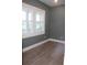 Room with neutral gray walls and wood-look floors at 2437 Bay Lake Loop, Groveland, FL 34736